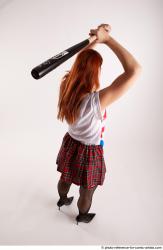 TINA STANDING POSE WITH BASEBALL BAT